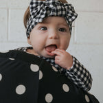 Black Gingham | Bamboo Head Wrap | Made from silky-soft bamboo material, this adjustable head wrap features a sweet bow for added style. Perfect for babies and toddlers!One size fits most Print: Black Gingham Material: 95% bamboo viscose / 5% spandex Care