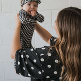 Black Gingham | Bamboo Head Wrap | Made from silky-soft bamboo material, this adjustable head wrap features a sweet bow for added style. Perfect for babies and toddlers!One size fits most Print: Black Gingham Material: 95% bamboo viscose / 5% spandex Care