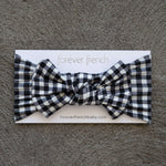 Black Gingham | Bamboo Head Wrap | Made from silky-soft bamboo material, this adjustable head wrap features a sweet bow for added style. Perfect for babies and toddlers!One size fits most Print: Black Gingham Material: 95% bamboo viscose / 5% spandex Care