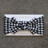 Black Gingham | Bamboo Head Wrap | Made from silky-soft bamboo material, this adjustable head wrap features a sweet bow for added style. Perfect for babies and toddlers!One size fits most Print: Black Gingham Material: 95% bamboo viscose / 5% spandex Care