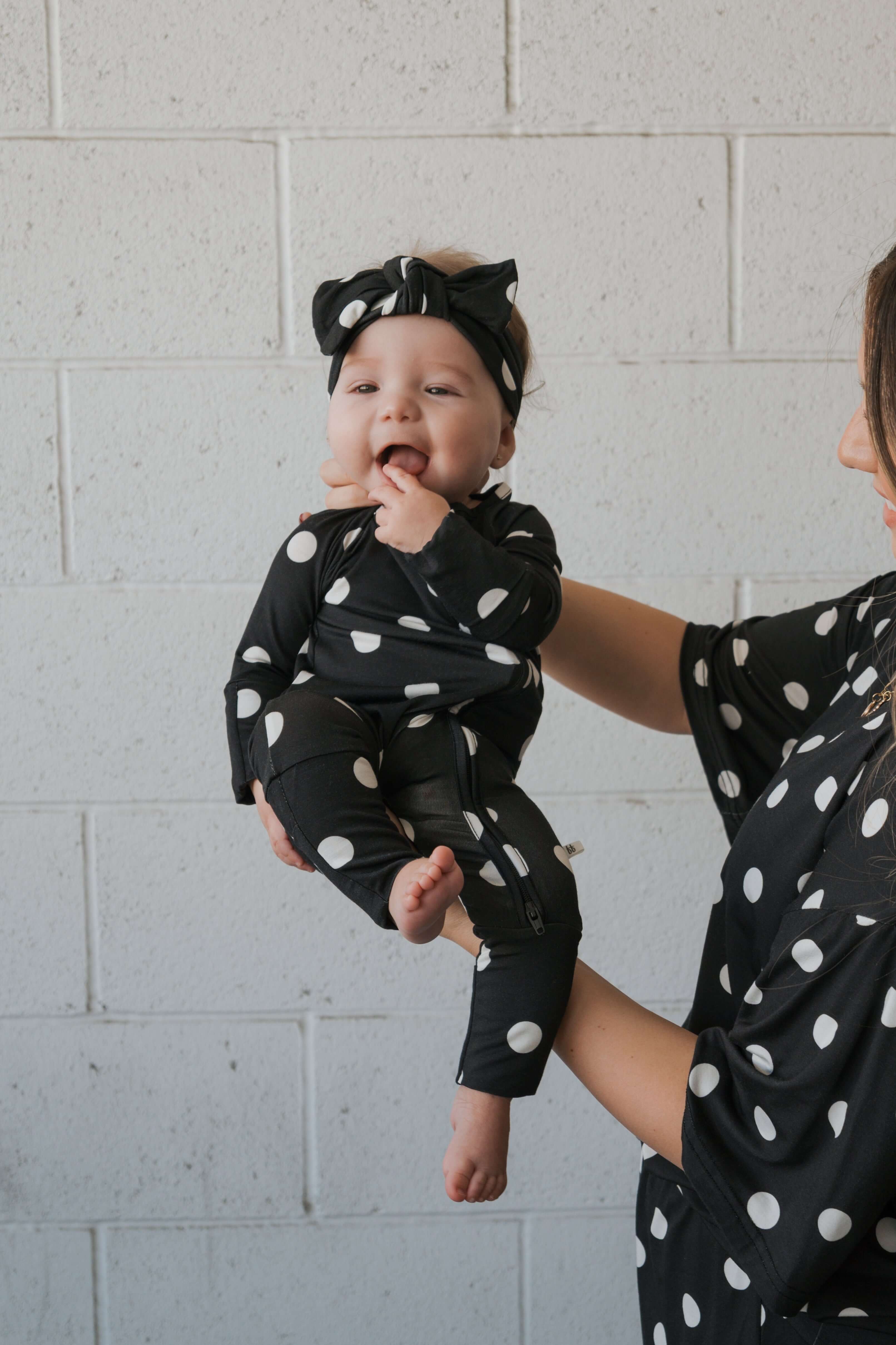 B&W Polka Dot | Bamboo Zip Pajamas | Made of the softest premium bamboo. Durable and well designed your little ones can sleep and play in these cozy pajamas. Our smallest sizes have rollover cuffs on the hands and all of the one piece sizes have cuffs on