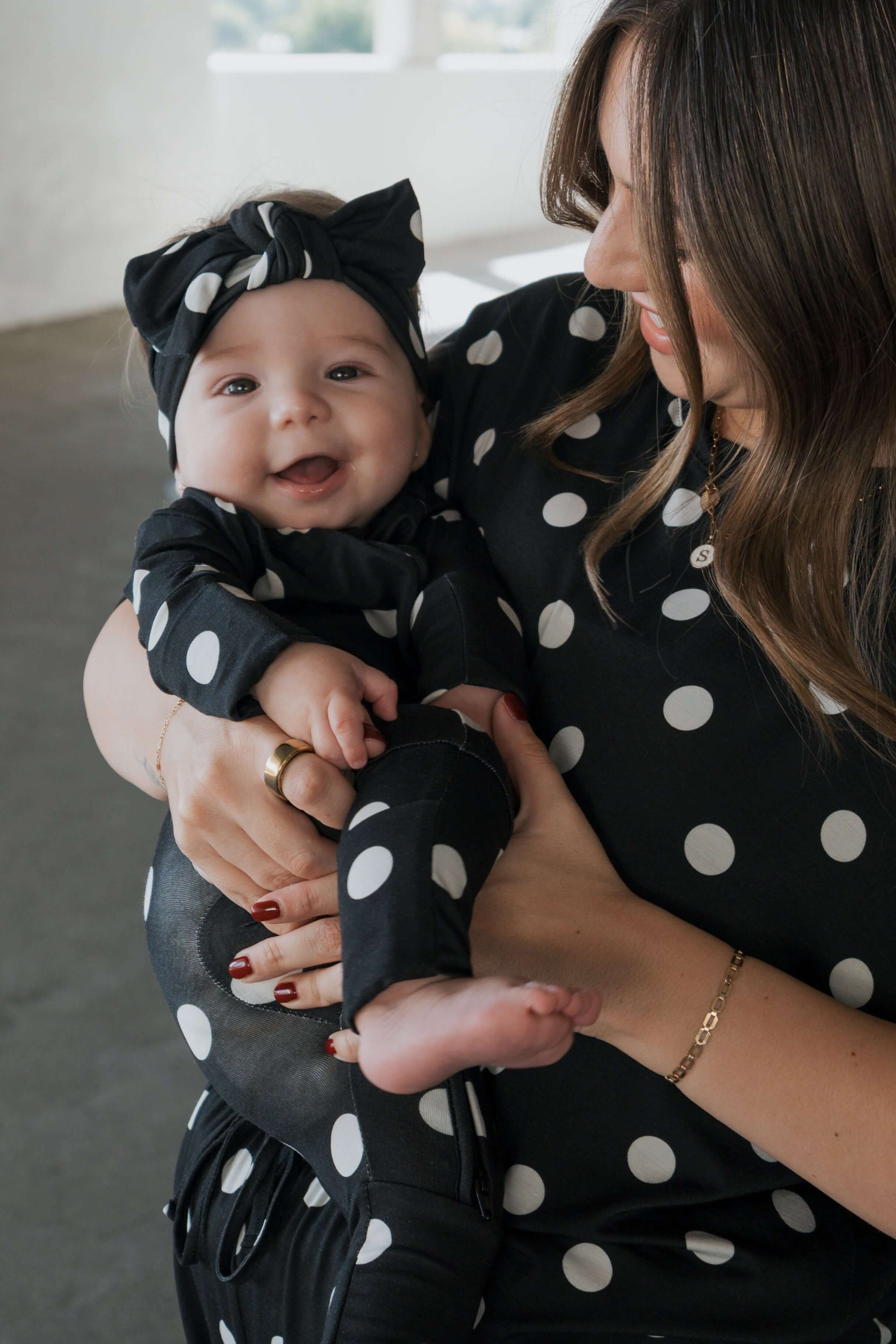 B&W Polka Dot | Bamboo Zip Pajamas | Made of the softest premium bamboo. Durable and well designed your little ones can sleep and play in these cozy pajamas. Our smallest sizes have rollover cuffs on the hands and all of the one piece sizes have cuffs on