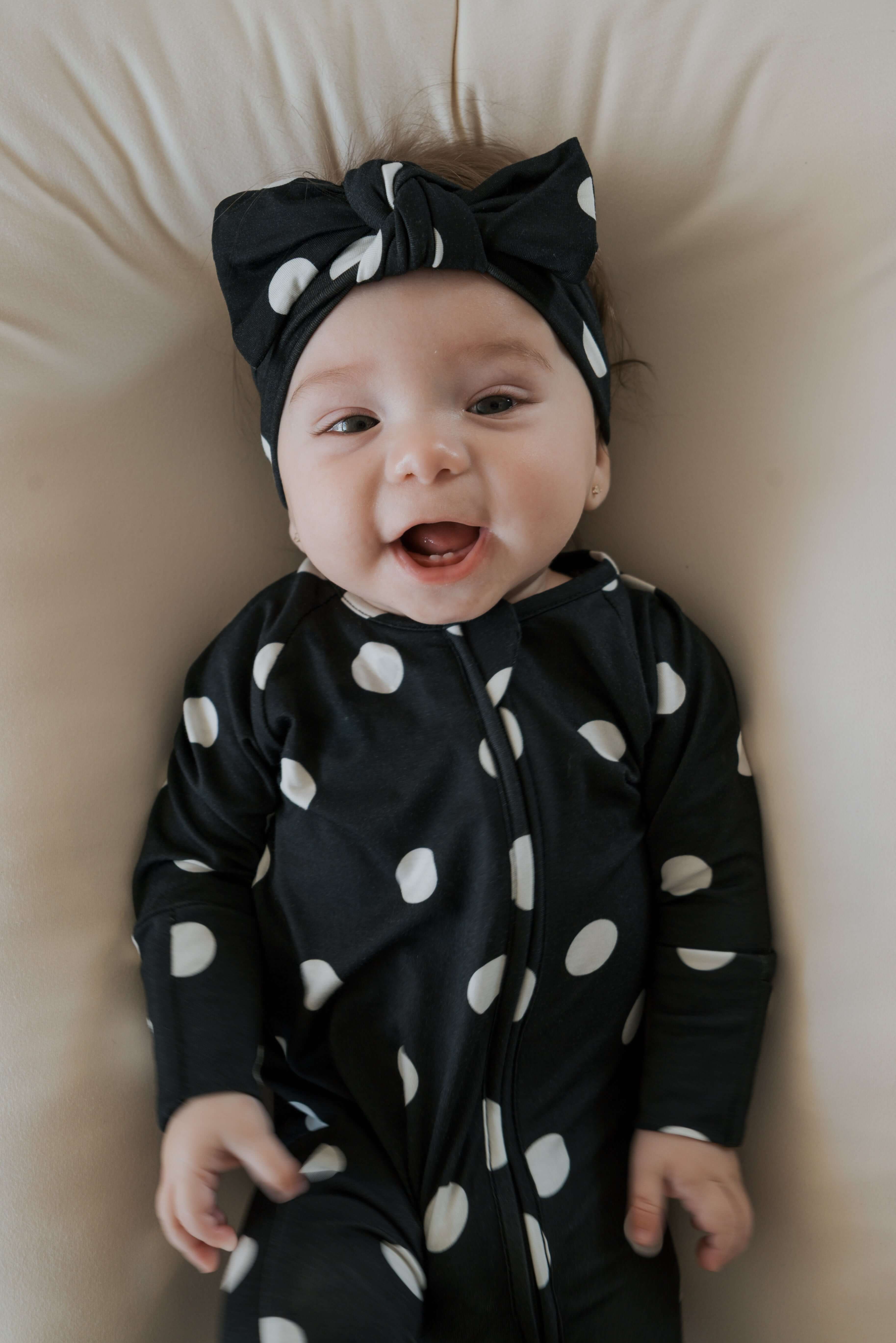 B&W Polka Dot | Bamboo Zip Pajamas | Made of the softest premium bamboo. Durable and well designed your little ones can sleep and play in these cozy pajamas. Our smallest sizes have rollover cuffs on the hands and all of the one piece sizes have cuffs on