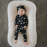 B&W Polka Dot | Bamboo Zip Pajamas | Made of the softest premium bamboo. Durable and well designed your little ones can sleep and play in these cozy pajamas. Our smallest sizes have rollover cuffs on the hands and all of the one piece sizes have cuffs on