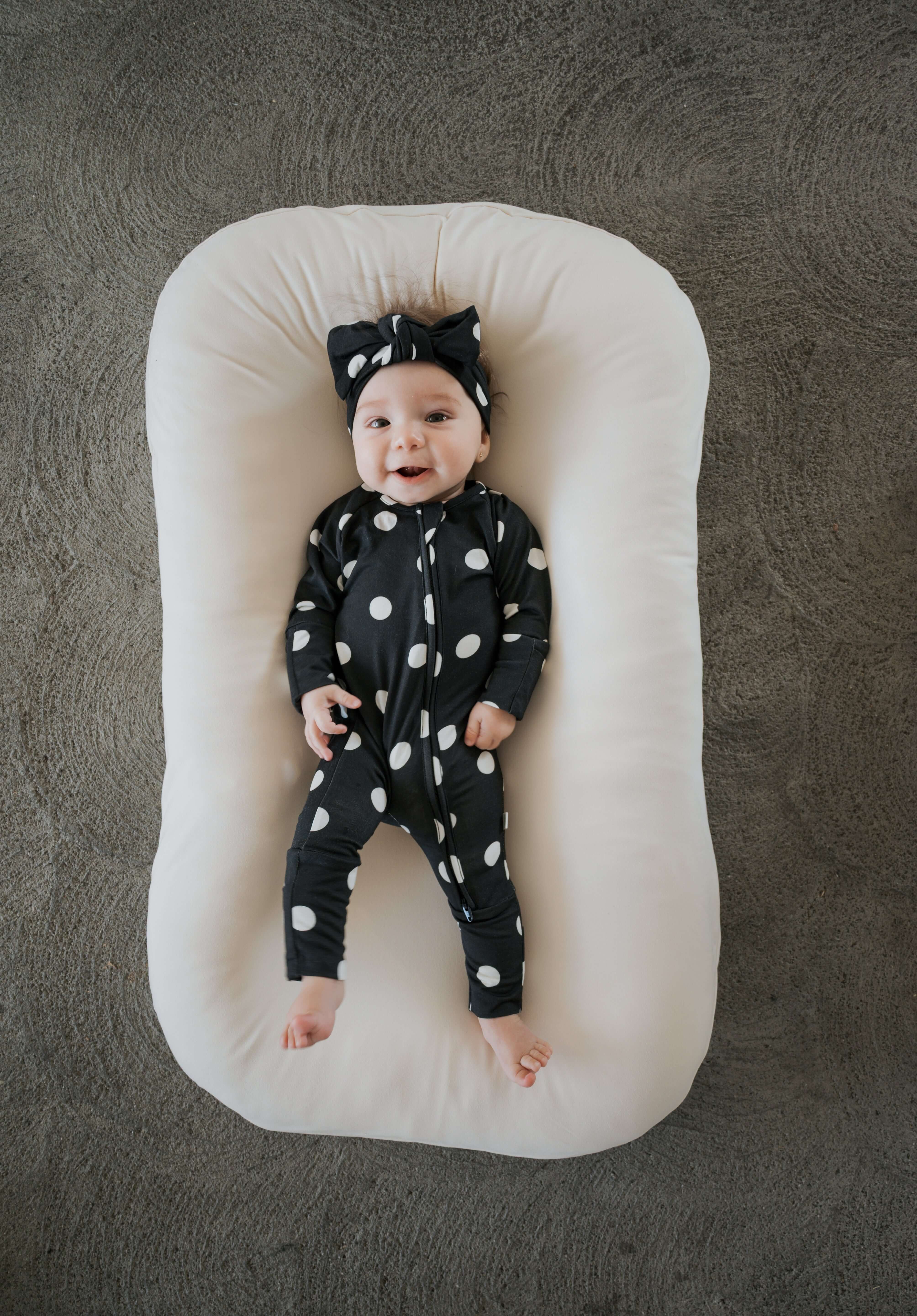 B&W Polka Dot | Bamboo Zip Pajamas | Made of the softest premium bamboo. Durable and well designed your little ones can sleep and play in these cozy pajamas. Our smallest sizes have rollover cuffs on the hands and all of the one piece sizes have cuffs on