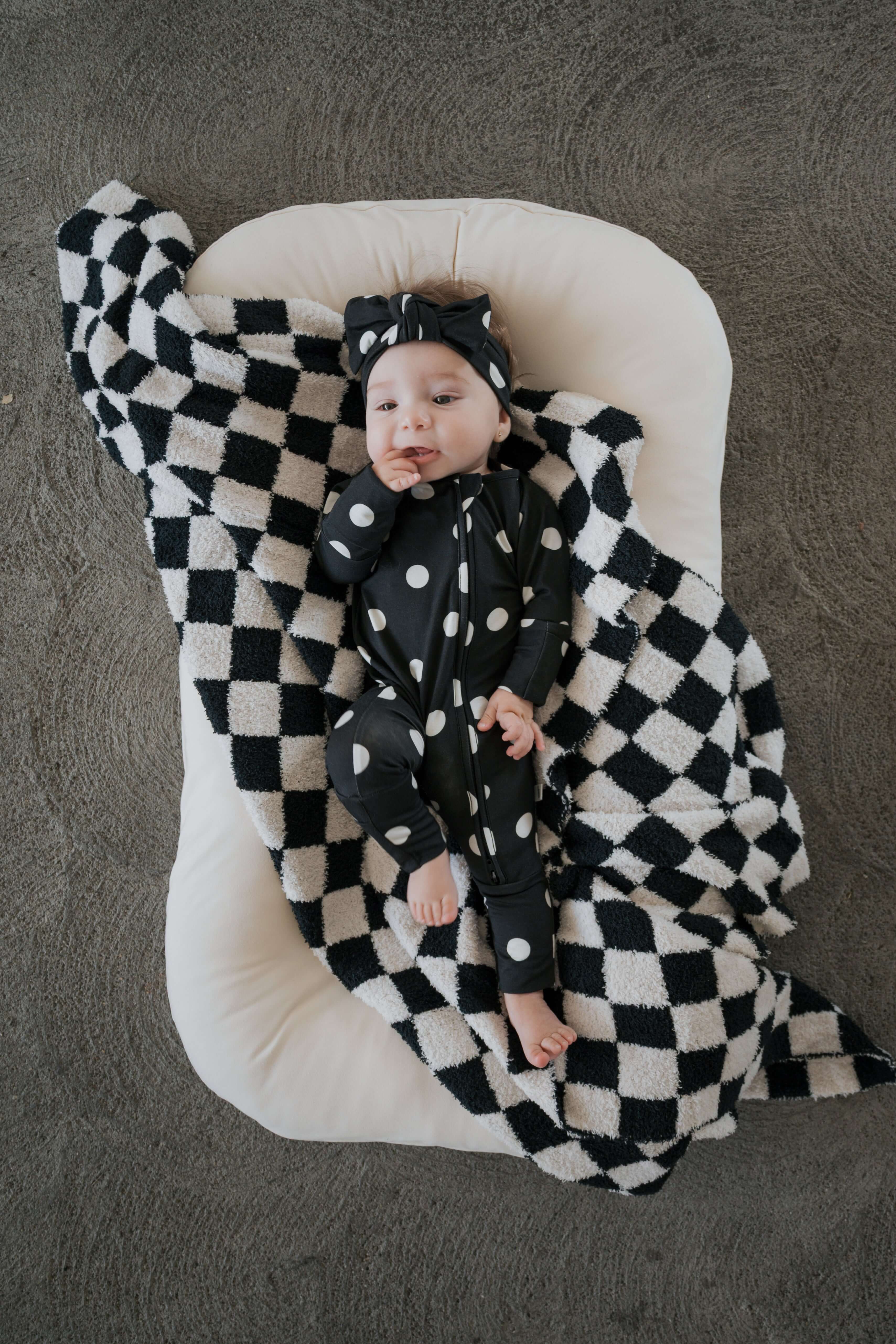 B&W Polka Dot | Bamboo Zip Pajamas | Made of the softest premium bamboo. Durable and well designed your little ones can sleep and play in these cozy pajamas. Our smallest sizes have rollover cuffs on the hands and all of the one piece sizes have cuffs on