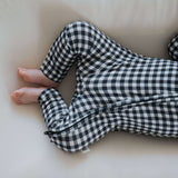 Black Gingham | Bamboo Zip Pajamas | Made of the softest premium bamboo. Durable and well designed your little ones can sleep and play in these cozy pajamas. Our smallest sizes have rollover cuffs on the hands and all of the one piece sizes have cuffs on