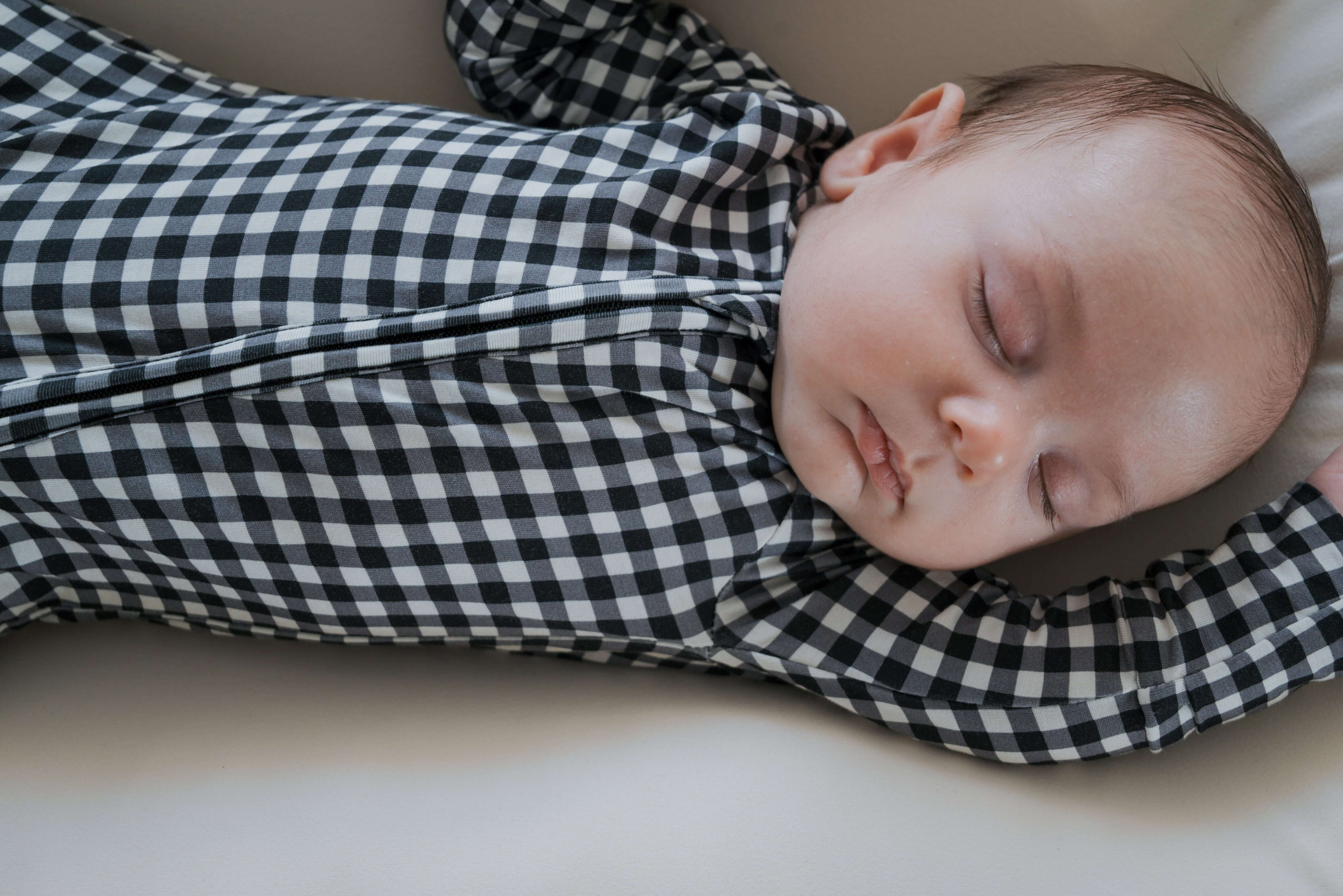 Black Gingham | Bamboo Zip Pajamas | Made of the softest premium bamboo. Durable and well designed your little ones can sleep and play in these cozy pajamas. Our smallest sizes have rollover cuffs on the hands and all of the one piece sizes have cuffs on