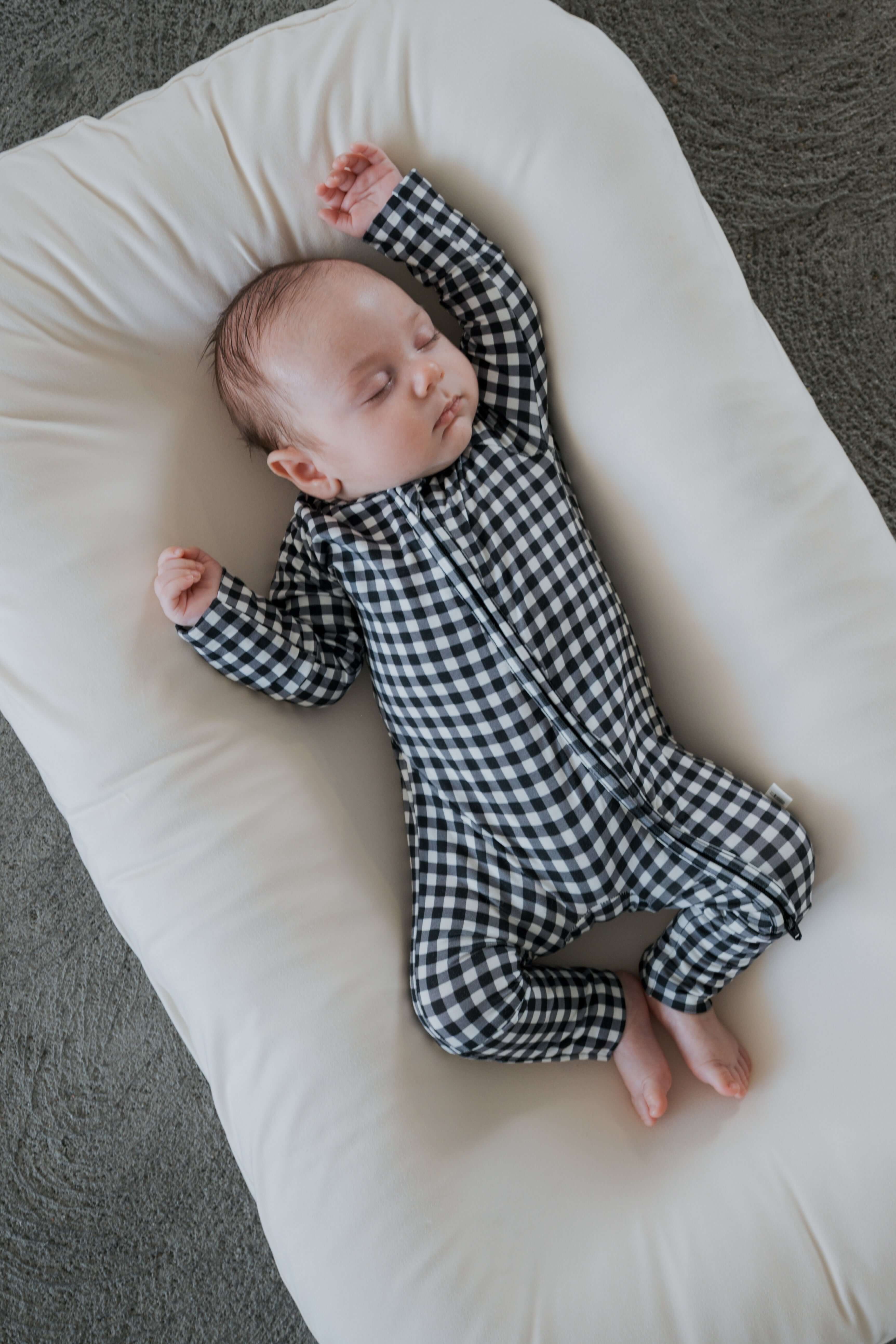 Black Gingham | Bamboo Zip Pajamas | Made of the softest premium bamboo. Durable and well designed your little ones can sleep and play in these cozy pajamas. Our smallest sizes have rollover cuffs on the hands and all of the one piece sizes have cuffs on