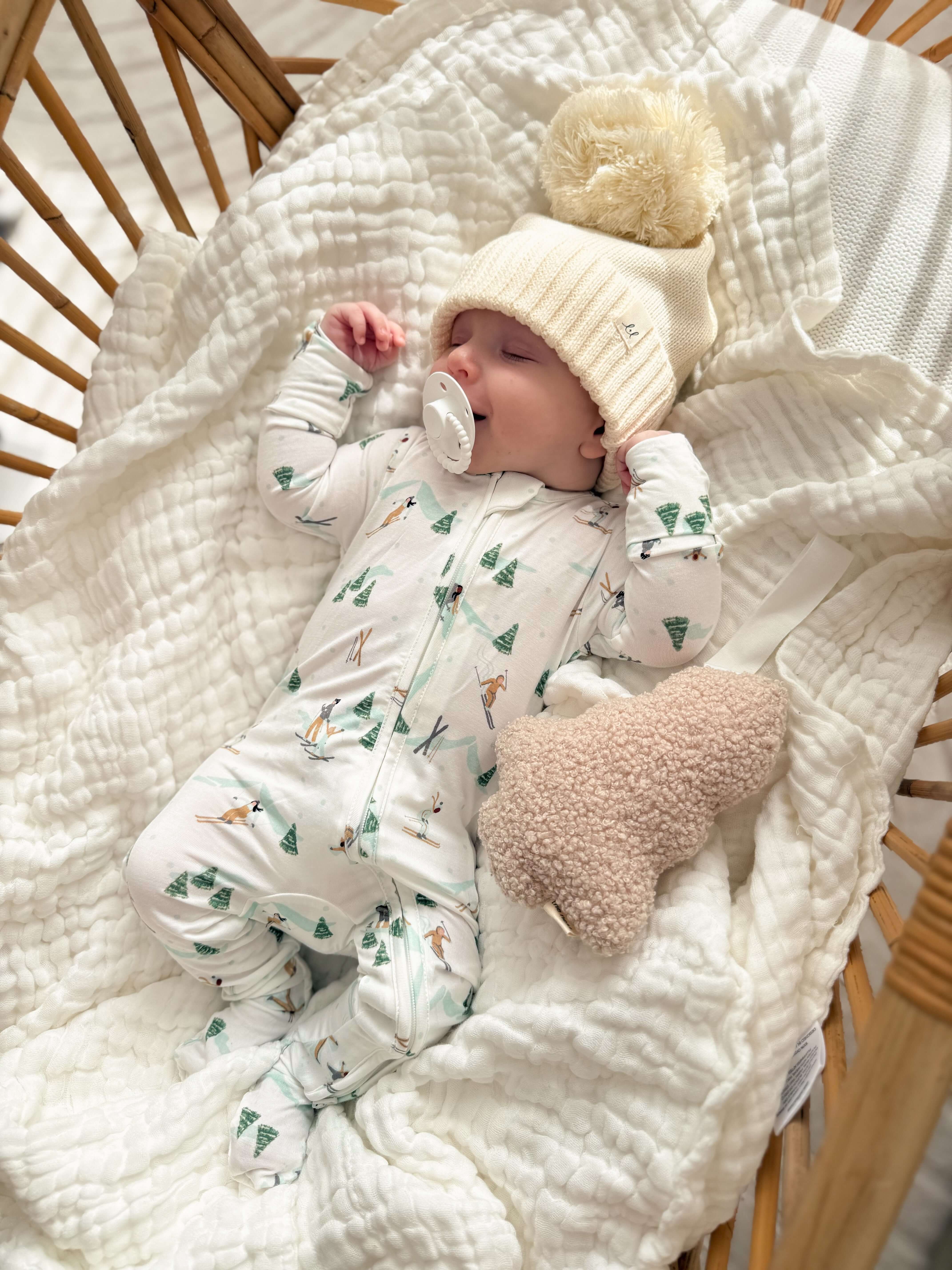 Hit the Slopes Bamboo Jumpsuit | Get cozy in our Bamboo Zip Pajamas! Perfect for skiing or napping, this jumpsuit features a fun snowy print and soft fabric for winter comfort. | Milk & Baby