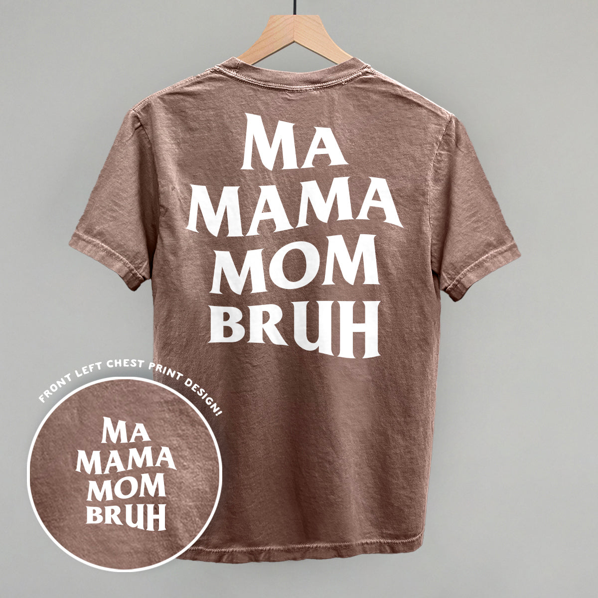 Ma Mama Mom Bruh back print design on a brown t-shirt hanging on a wooden hanger