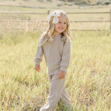 Little girl in striped loungewear set playing outdoors | Striped Loungewear Set | Babies & Kids