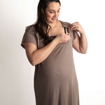 Woman wearing a ribbed cocoa brown Labor & Delivery Gown, adjusting a snap for easy access during breastfeeding.