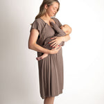 Woman in a cocoa brown Labor & Delivery Gown cradling a baby, showcasing comfort and style for new mothers.