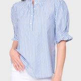 Woman wearing a blue and white striped shirt on a white background