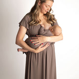 Woman wearing a Ribbed Cocoa Brown Labor & Delivery Gown while holding an infant.