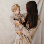 Mom and baby in matching Striped Loungewear Set | Women's, smiling in cozy comfort.