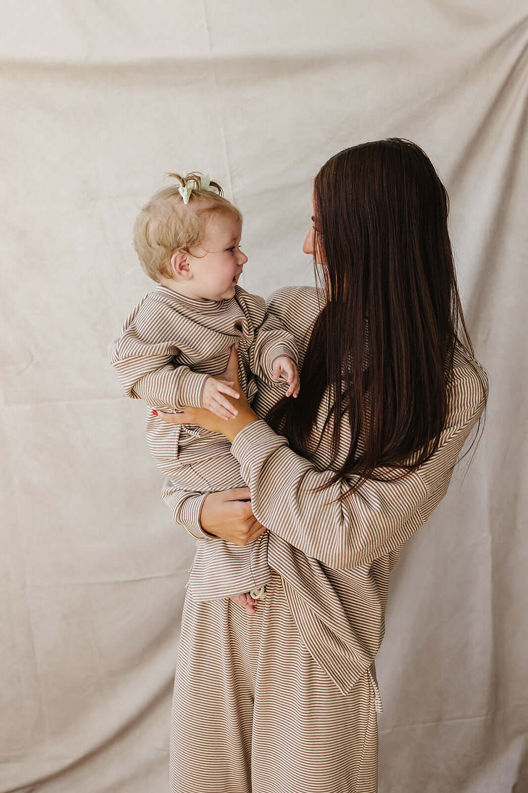 Mom and baby in matching Striped Loungewear Set | Women's, smiling in cozy comfort.