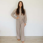 Woman wearing a striped loungewear set, showcasing the comfortable and stylish design of Striped Loungewear Set | Women's.