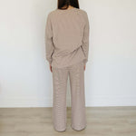 Back view of a woman wearing the Striped Loungewear Set | Women's, showcasing a cozy and stylish outfit.
