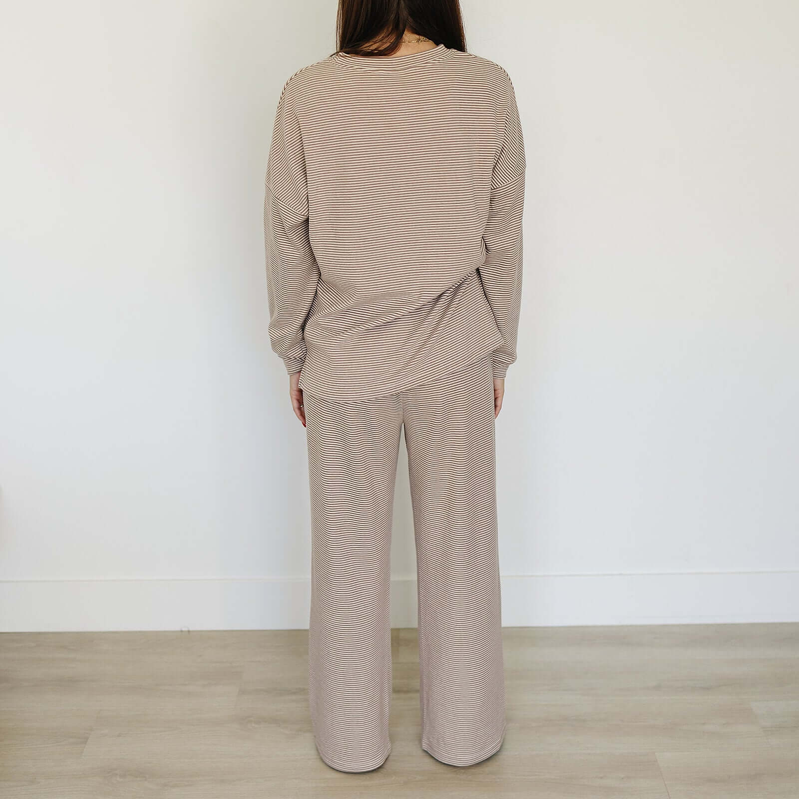Back view of a woman wearing the Striped Loungewear Set | Women's, showcasing a cozy and stylish outfit.