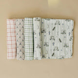 Tee Time Muslin Swaddle Blanket | Wrap your little one in the softness of our Tee Time Muslin Swaddle Blanket. Made from 100% Cotton, these blankets are as soft as butter and get even softer with each wash. Designed with both parents and babies in mind, t