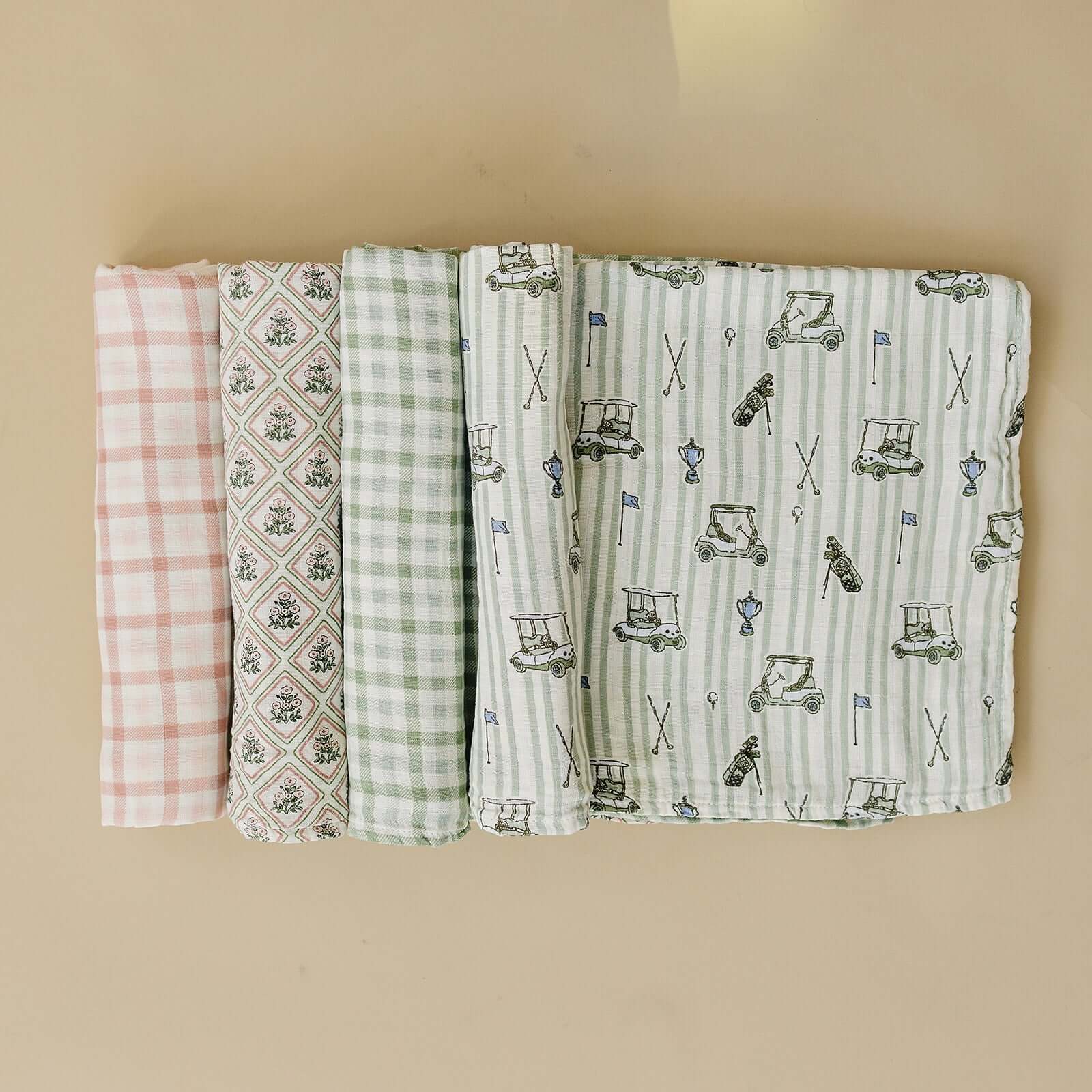 Tee Time Muslin Swaddle Blanket | Wrap your little one in the softness of our Tee Time Muslin Swaddle Blanket. Made from 100% Cotton, these blankets are as soft as butter and get even softer with each wash. Designed with both parents and babies in mind, t