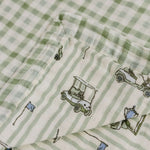 Tee Time + Green Gingham Muslin Quilt | Indulge your little one in the cozy comfort of our Muslin Quilt. Crafted from the same fabric as our beloved muslin swaddles, this four-layer quilt offers warmth and softness for a restful sleep. Our neutral colors