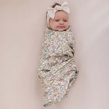 Sunny Petals Muslin Swaddle Blanket | Wrap your little one in the softness of our Sunny Petals Muslin Swaddle Blanket. Made from 100% Cotton, these blankets are as soft as butter and get even softer with each wash. Designed with both parents and babies in