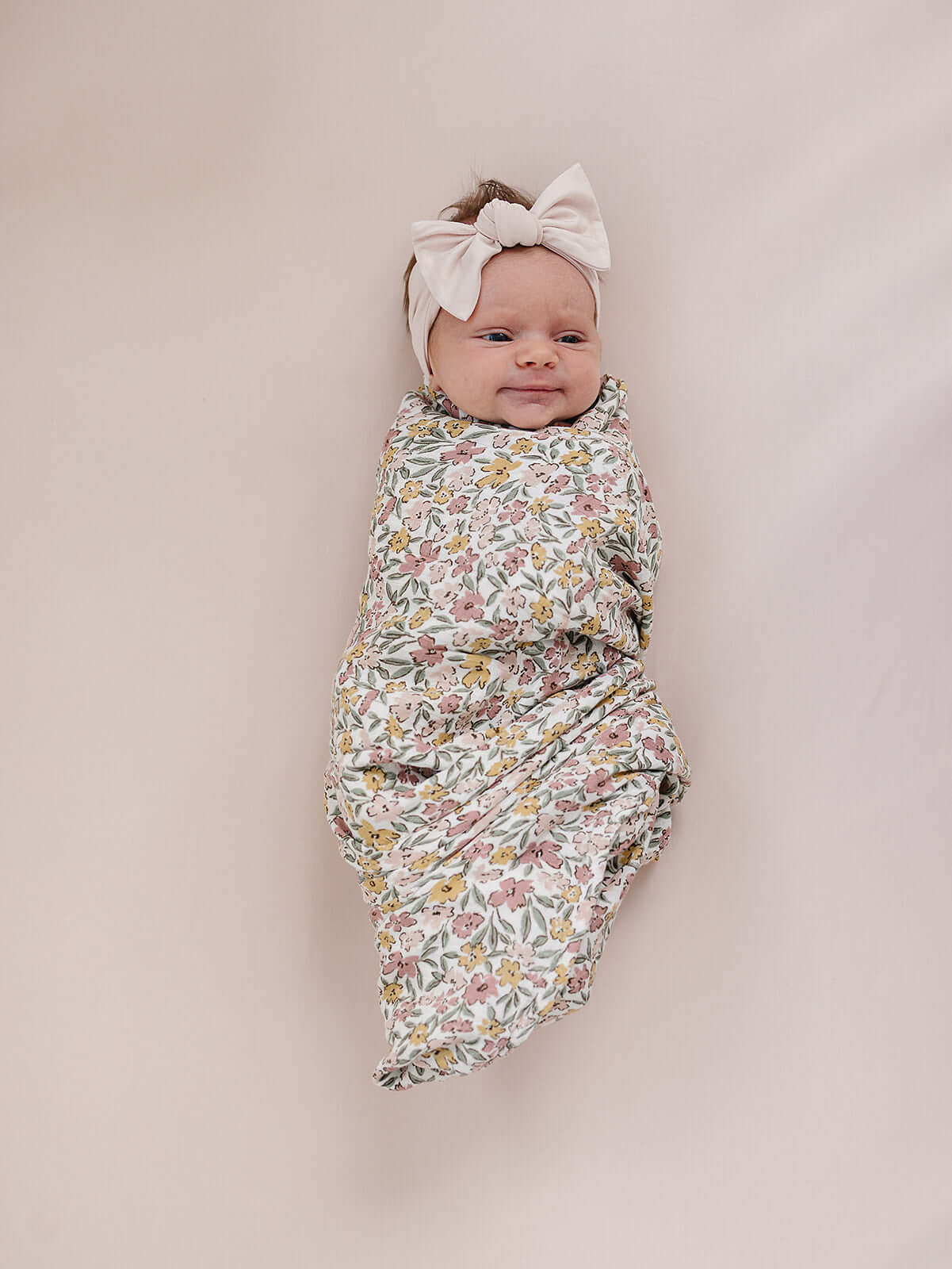 Sunny Petals Muslin Swaddle Blanket | Wrap your little one in the softness of our Sunny Petals Muslin Swaddle Blanket. Made from 100% Cotton, these blankets are as soft as butter and get even softer with each wash. Designed with both parents and babies in