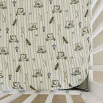 Tee Time Muslin Crib Sheet | Transform your baby's crib into a cozy haven with our Tee Time Muslin Crib Sheet. Crafted from our exclusive soft and breathable muslin fabric, this sheet showcases a neutral design that adds a touch of warmth and style to the