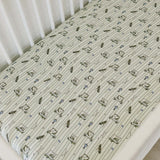Tee Time Muslin Crib Sheet | Transform your baby's crib into a cozy haven with our Tee Time Muslin Crib Sheet. Crafted from our exclusive soft and breathable muslin fabric, this sheet showcases a neutral design that adds a touch of warmth and style to the