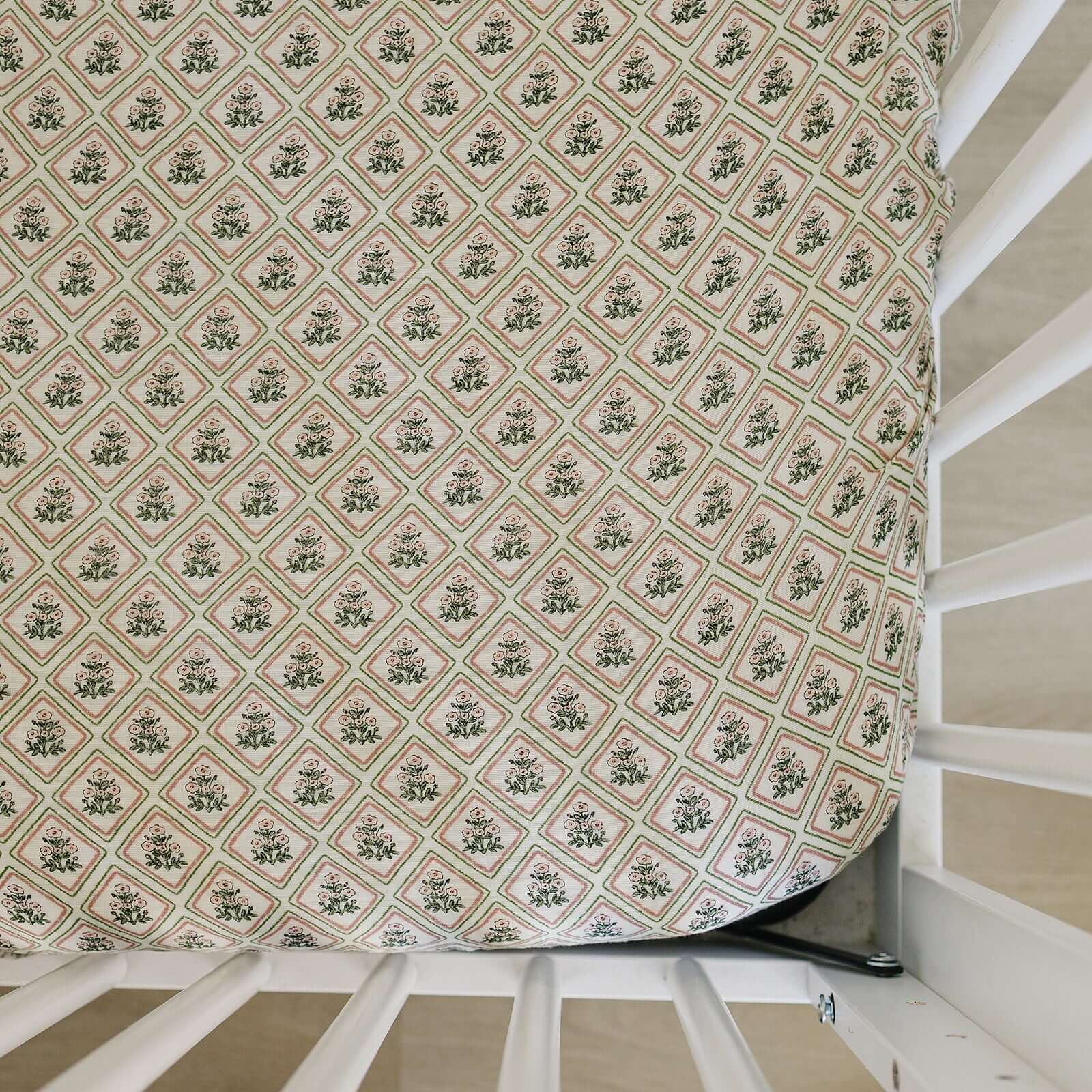 Country Garden Floral Muslin Crib Sheet | Transform your baby's crib into a cozy haven with our Country Garden Floral Muslin Crib Sheet. Crafted from our exclusive soft and breathable muslin fabric, this sheet showcases a neutral design that adds a touch