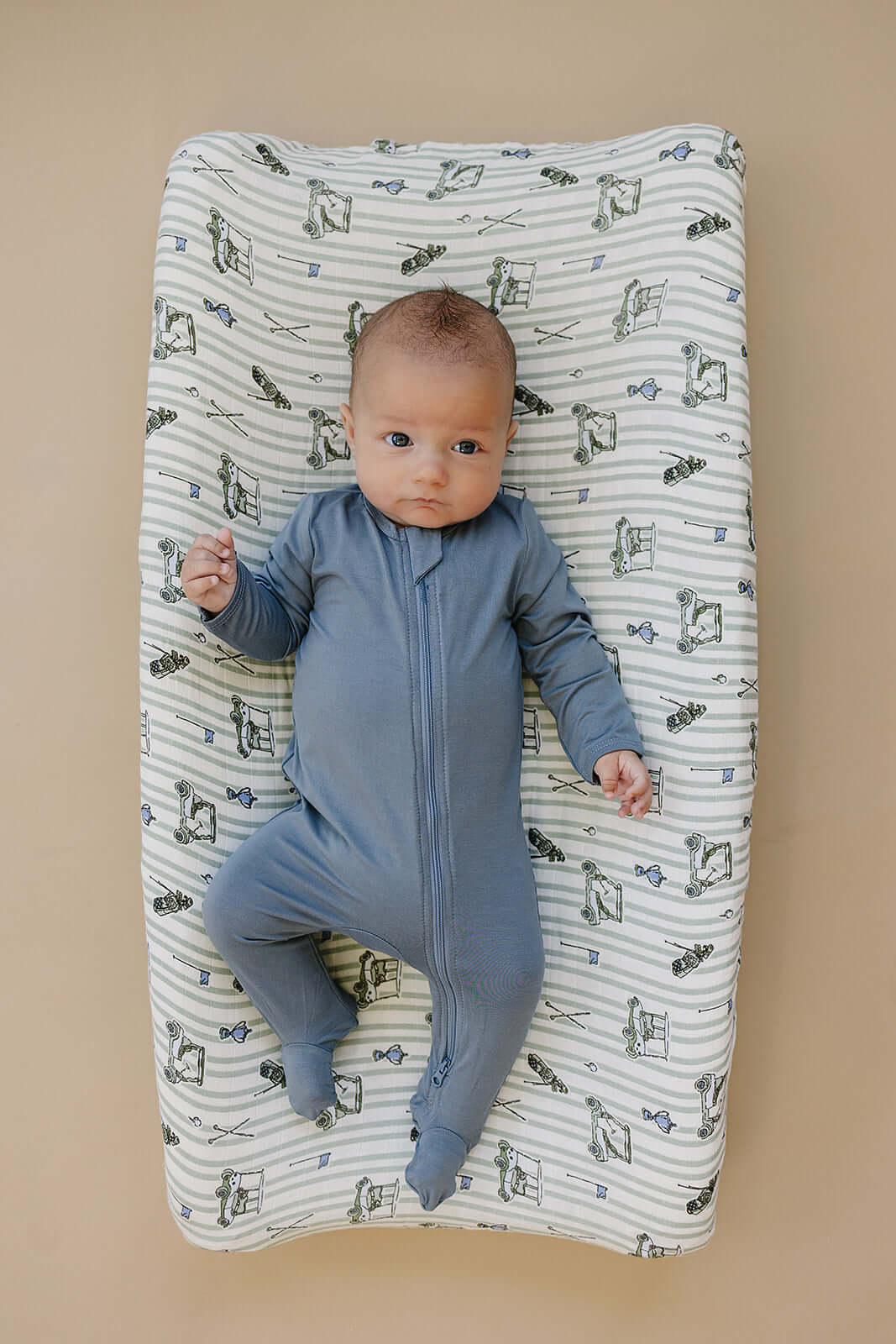Tee Time Muslin Changing Pad Cover | Transform your baby's changing area with the Mebie Baby Tee Time Muslin Changing Pad Cover. Made from soft and breathable muslin fabric, this cover is gentle on your baby's skin. The fun design adds a touch of modern s