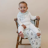 Tee Time + Green Gingham Muslin Quilt | Indulge your little one in the cozy comfort of our Muslin Quilt. Crafted from the same fabric as our beloved muslin swaddles, this four-layer quilt offers warmth and softness for a restful sleep. Our neutral colors