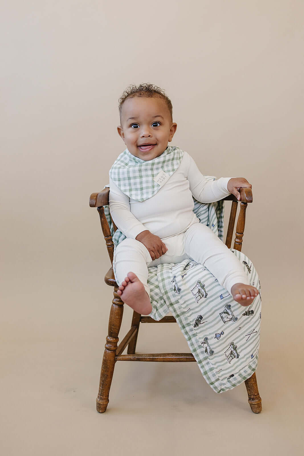 Tee Time + Green Gingham Muslin Quilt | Indulge your little one in the cozy comfort of our Muslin Quilt. Crafted from the same fabric as our beloved muslin swaddles, this four-layer quilt offers warmth and softness for a restful sleep. Our neutral colors