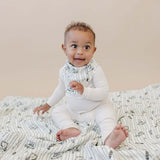 Tee Time + Green Gingham Muslin Quilt | Indulge your little one in the cozy comfort of our Muslin Quilt. Crafted from the same fabric as our beloved muslin swaddles, this four-layer quilt offers warmth and softness for a restful sleep. Our neutral colors