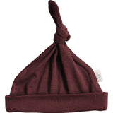 Deep Violet Ribbed Bamboo Newborn Knot Hat, perfect for keeping your little babe warm and stylish.