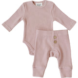 Pink Waffle Set | Milk & Baby | Comfy, cozy, and cute — our Pink Waffle Set is an everyday essential. Made from soft waffle-knit fabric, this matching set includes a long sleeve bodysuit and relaxed-fit pants for a cozy, all-day feel. Snaps at the bottom