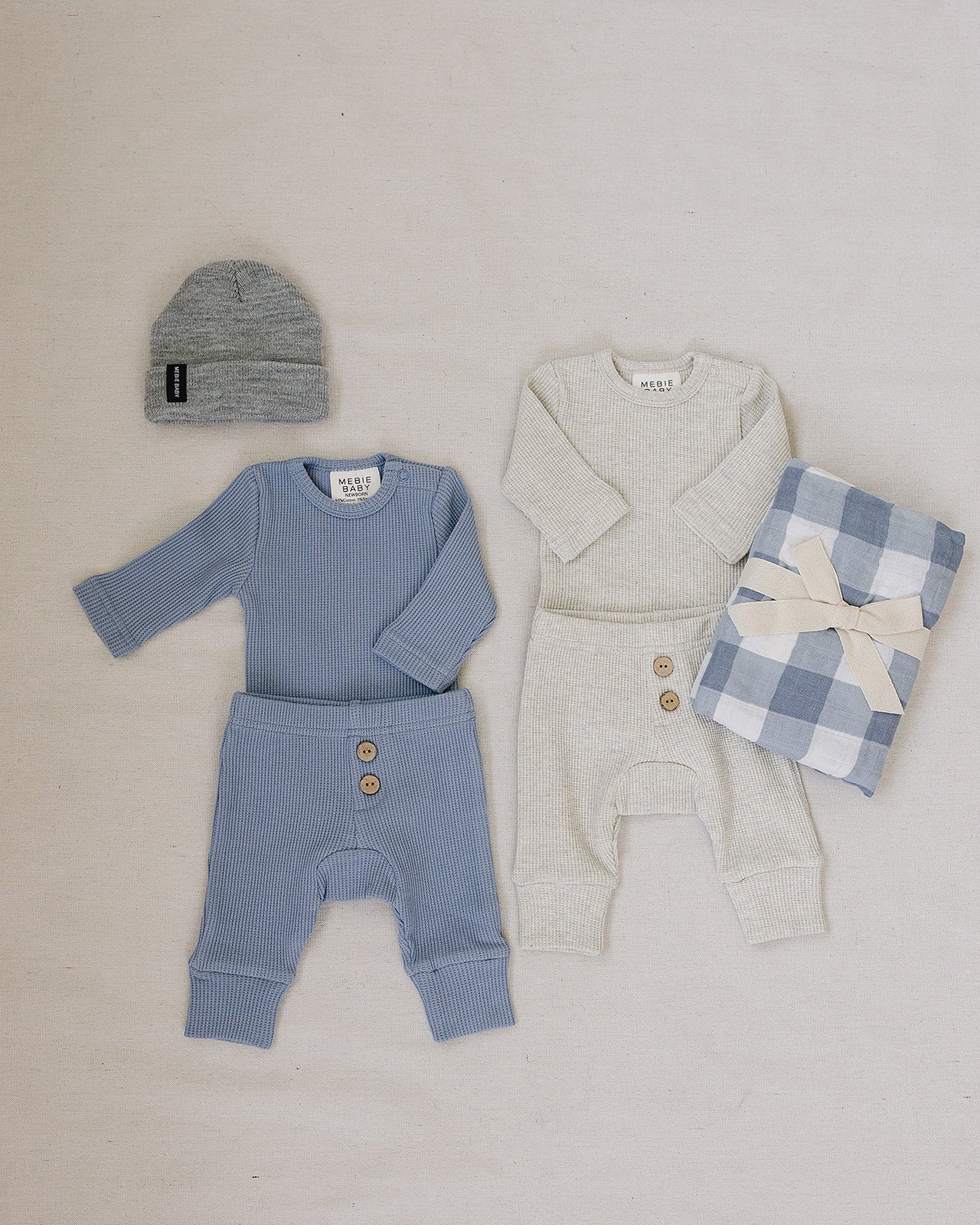 Dusty Blue Waffle Set | Milk & Baby | Comfy, cozy, and cute — our Dusty Blue Waffle Set is an everyday essential. Made from soft waffle-knit fabric, this matching set includes a long sleeve bodysuit and relaxed-fit pants for a cozy, all-day feel. Snaps at