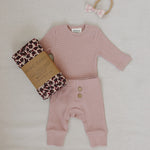 Pink Waffle Set | Milk & Baby | Comfy, cozy, and cute — our Pink Waffle Set is an everyday essential. Made from soft waffle-knit fabric, this matching set includes a long sleeve bodysuit and relaxed-fit pants for a cozy, all-day feel. Snaps at the bottom