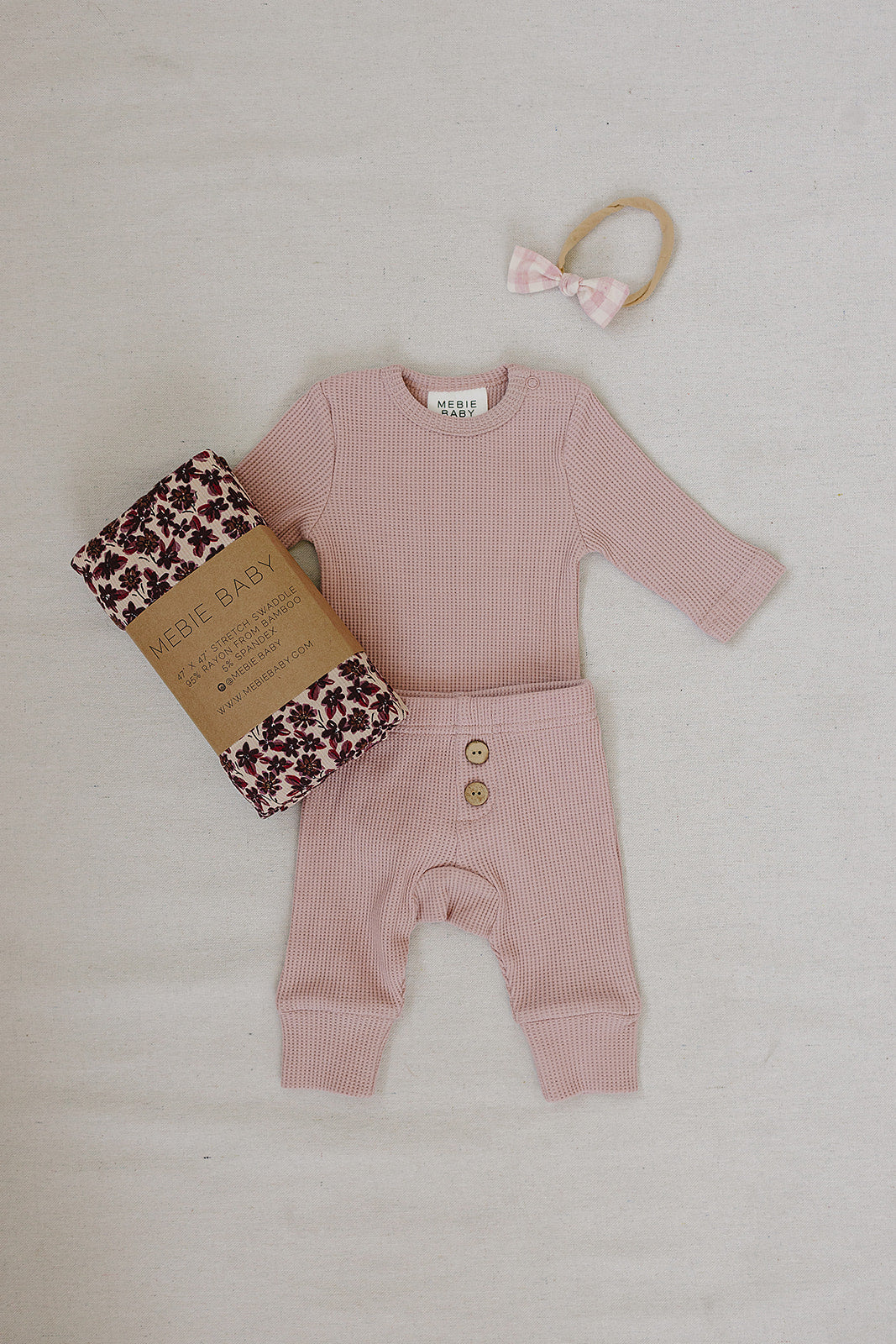 Pink Waffle Set | Milk & Baby | Comfy, cozy, and cute — our Pink Waffle Set is an everyday essential. Made from soft waffle-knit fabric, this matching set includes a long sleeve bodysuit and relaxed-fit pants for a cozy, all-day feel. Snaps at the bottom