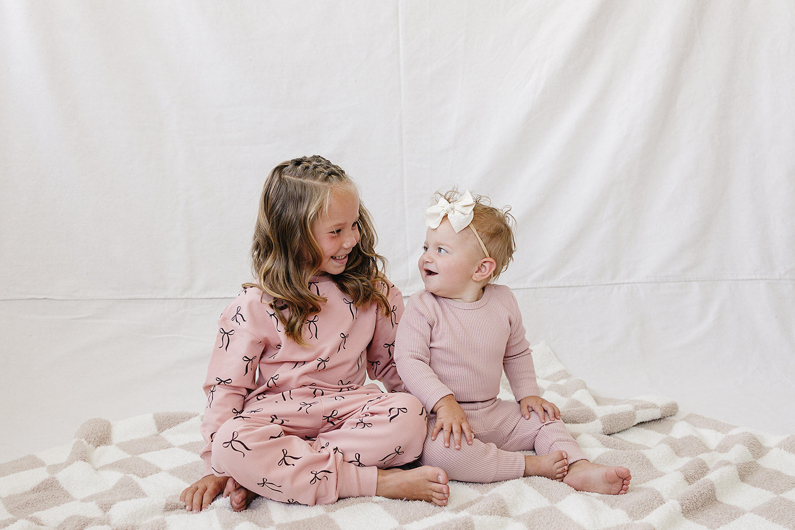 Pink Waffle Set | Milk & Baby | Comfy, cozy, and cute — our Pink Waffle Set is an everyday essential. Made from soft waffle-knit fabric, this matching set includes a long sleeve bodysuit and relaxed-fit pants for a cozy, all-day feel. Snaps at the bottom