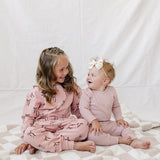 Pink Waffle Set | Milk & Baby | Comfy, cozy, and cute — our Pink Waffle Set is an everyday essential. Made from soft waffle-knit fabric, this matching set includes a long sleeve bodysuit and relaxed-fit pants for a cozy, all-day feel. Snaps at the bottom