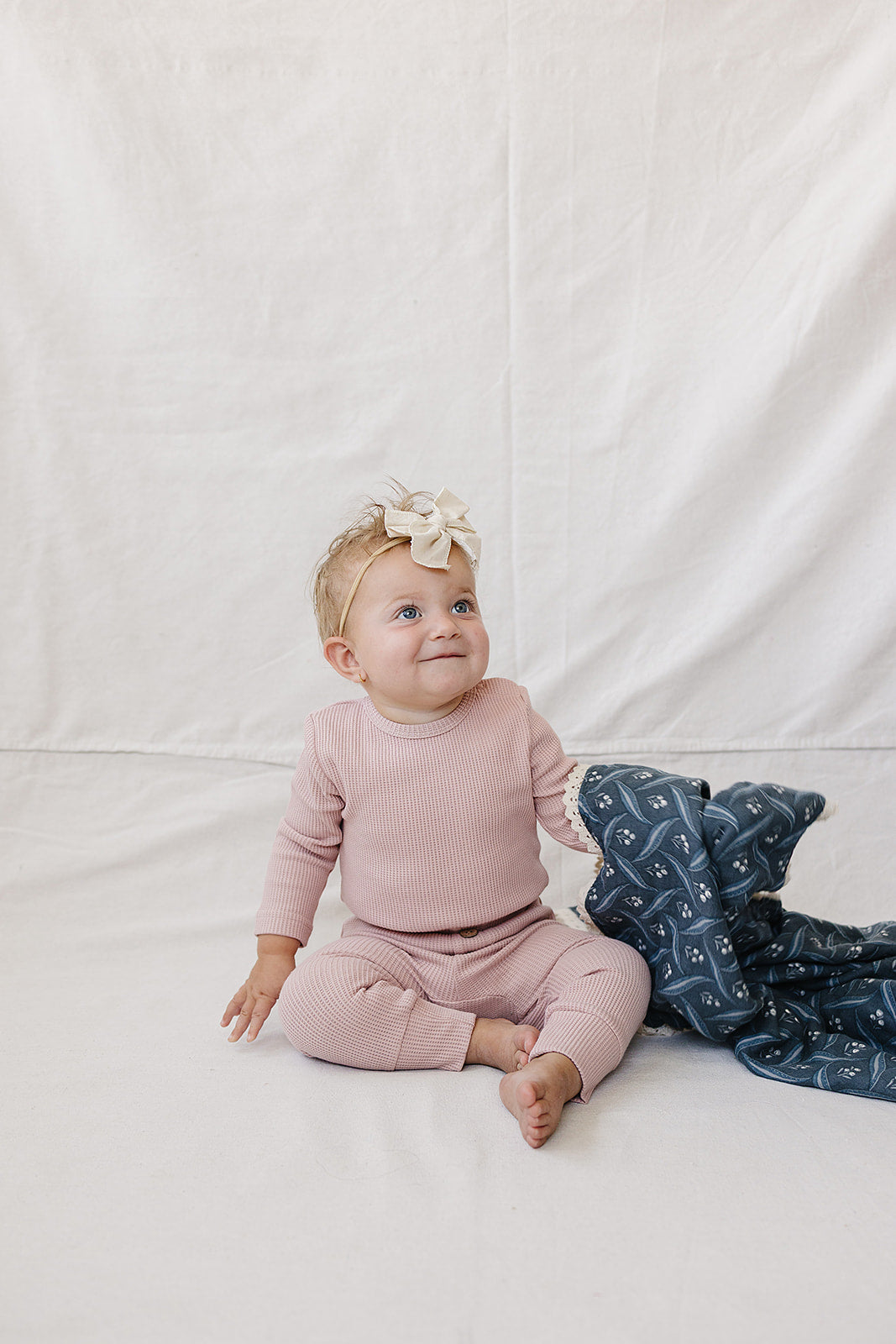 Pink Waffle Set | Milk & Baby | Comfy, cozy, and cute — our Pink Waffle Set is an everyday essential. Made from soft waffle-knit fabric, this matching set includes a long sleeve bodysuit and relaxed-fit pants for a cozy, all-day feel. Snaps at the bottom