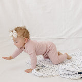Pink Waffle Set | Milk & Baby | Comfy, cozy, and cute — our Pink Waffle Set is an everyday essential. Made from soft waffle-knit fabric, this matching set includes a long sleeve bodysuit and relaxed-fit pants for a cozy, all-day feel. Snaps at the bottom
