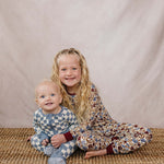Blue Checkered Bamboo Zipper | The Blue Checkered Bamboo Zipper pajamas are a must-have for your baby's wardrobe. Made from soft bamboo fabric, these gender-neutral footed pajamas feature a convenient double zipper design that allows for easy diaper chang