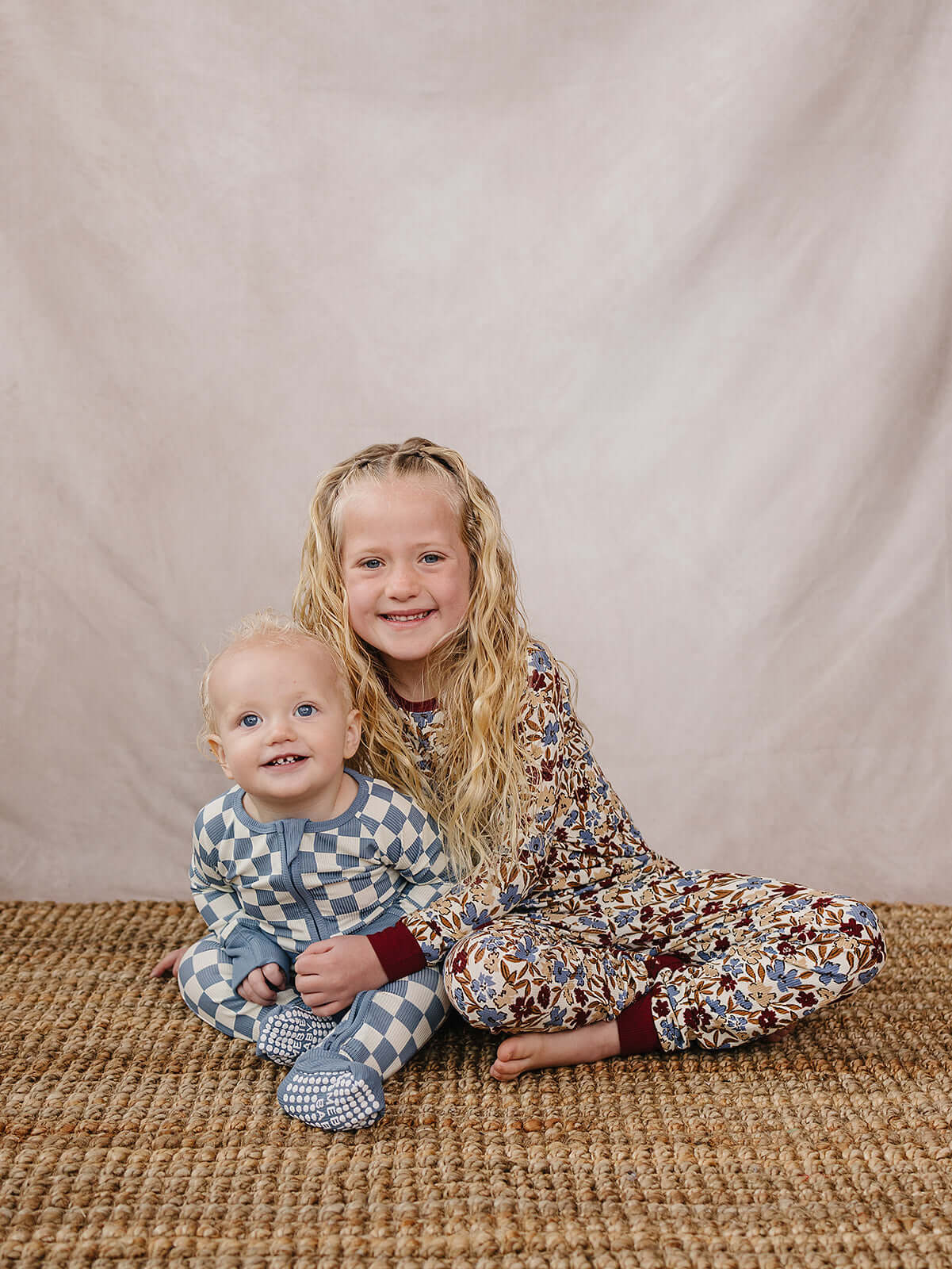 Blue Checkered Bamboo Zipper | The Blue Checkered Bamboo Zipper pajamas are a must-have for your baby's wardrobe. Made from soft bamboo fabric, these gender-neutral footed pajamas feature a convenient double zipper design that allows for easy diaper chang