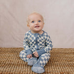 Blue Checkered Bamboo Zipper | The Blue Checkered Bamboo Zipper pajamas are a must-have for your baby's wardrobe. Made from soft bamboo fabric, these gender-neutral footed pajamas feature a convenient double zipper design that allows for easy diaper chang
