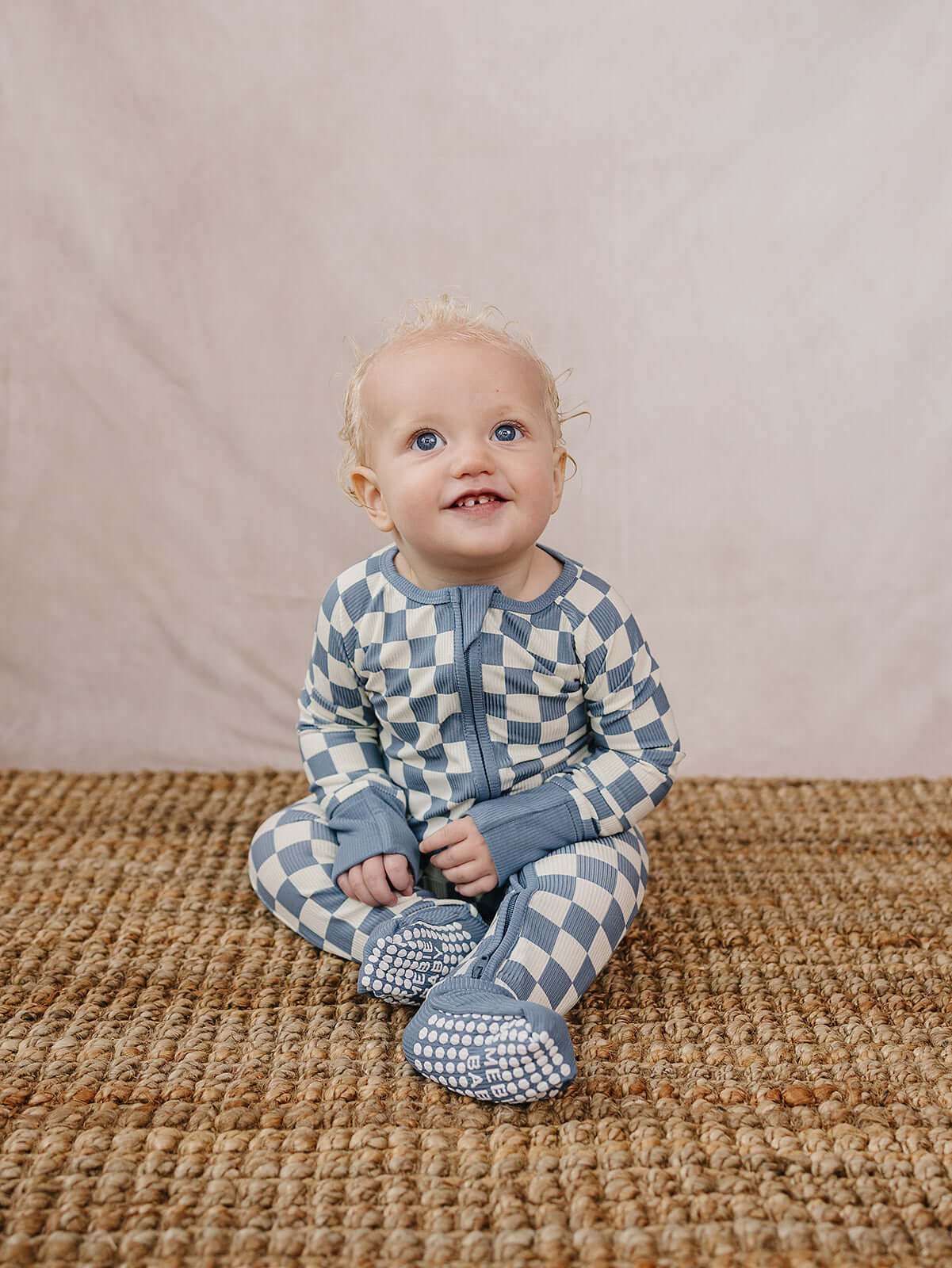 Blue Checkered Bamboo Zipper | The Blue Checkered Bamboo Zipper pajamas are a must-have for your baby's wardrobe. Made from soft bamboo fabric, these gender-neutral footed pajamas feature a convenient double zipper design that allows for easy diaper chang